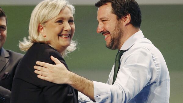 French National Front head Marine Le Pen, left, hugs Italy's Northern League leader Matteo Salvini during the Europe of Nations and Freedom movement meeting in Milan, Italy. File photo - Sputnik International