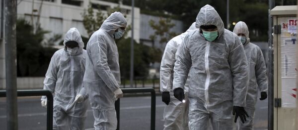 Greek police experts investigate the area in front of the Court of Appeal in Athens, Friday, Dec. 22, 2017 - Sputnik International