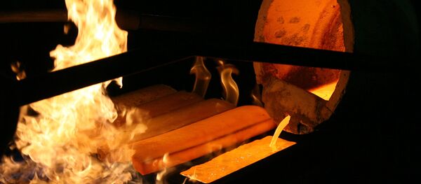 Standard 24 karat gold bars being cast in the foundry of the Novosibirsk gold refinery Standard 24 karat gold bars being cast in the foundry of the Novosibirsk gold refinery - Sputnik International
