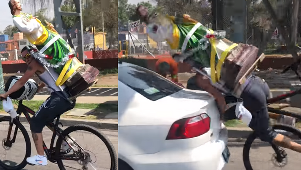 Distracted Cyclist Faceplants, Shatters St. Jude Statue in Collision - Sputnik International