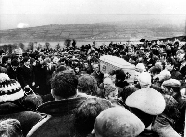 In this Feb. 2, 1972, file photo Pallbearers carry one of 13 coffins of Bloody Sunday victims to a graveside during a funeral in Derry, Northern Ireland, following requiem mass at nearby St. Mary's church at Creggan Hill. In this Feb. 2, 1972, file photo Pallbearers carry one of 13 coffins of Bloody Sunday victims to a graveside during a funeral in Derry, Northern Ireland, following requiem mass at nearby St. Mary's church at Creggan Hill. - Sputnik International
