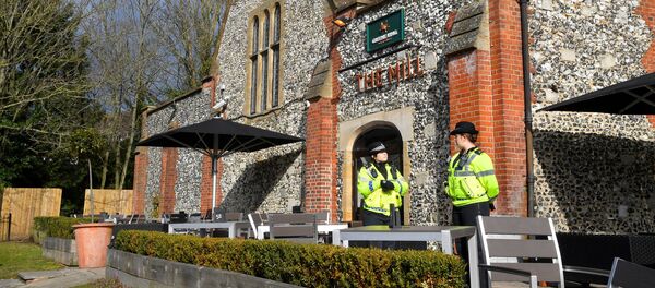 Police officers stand outside a pub near to where former Russian inteligence officer Sergei Skripal, and his daughter Yulia were found unconscious after they had been exposed to an unknown substance, in Salisbury, Britain, March 7, 2018 Police officers stand outside a pub near to where former Russian inteligence officer Sergei Skripal, and his daughter Yulia were found unconscious after they had been exposed to an unknown substance, in Salisbury, Britain, March 7, 2018 - Sputnik International
