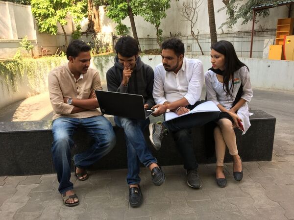 Priyanka and her cousin Vivek (extreme right) with their fellow community youths planning for their ‘Stop The V Ritual’ campaign - Sputnik International