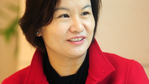 This picture taken on March 12, 2015 shows Zhou Qunfei, chairwoman and president of Hunan-based Lens Technology, during an interview in Changsha, central China's Hunan province - Sputnik International