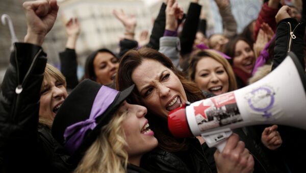 People, mostly women, shout slogans during a protest at the Sol square during the International Women's Day in Madrid, Thursday, March 8, 2018 - Sputnik International