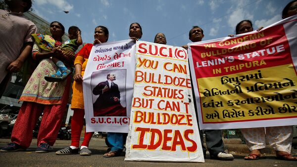 Activists of Socialist Unity Centre of India (SUCI) hold placards and shout anti-government slogans during a protest against what they say was the demolition of a statue of Vladimir Lenin in the northeastern state of Tripura on Monday, in Ahmedabad, India, March 7, 2018 - Sputnik International