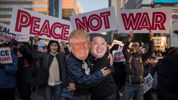 Demonstrators dressed as North Korean leader Kim Jong-Un (R) and US President Donald Trump (L) embrace during a peace rally in Seoul on November 5, 2017 - Sputnik International