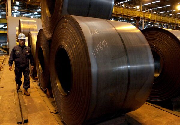 A worker walks by rolls of steel products at Posco steel mill in Pohang, south of Seoul, South Korea, Friday, Dec. 5, 2003 A worker walks by rolls of steel products at Posco steel mill in Pohang, south of Seoul, South Korea, Friday, Dec. 5, 2003 - Sputnik International