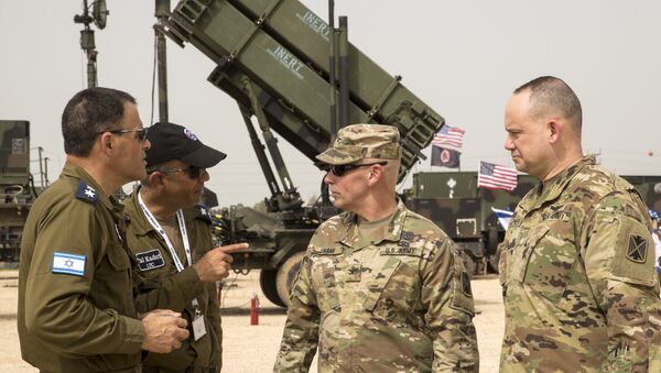 US and Israeli army officers talk in front a US Patriot missile defence system during the Israeli-US military exercise Juniper Cobra at the Hatzor Airforce Base in Israel on March 8, 2018 - Sputnik International