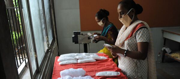 (File) Members of Self Employed Women's Association (SEWA) make low cost sanitary pads at their facility in Ahmedabad on September 3, 2012 (File) Members of Self Employed Women's Association (SEWA) make low cost sanitary pads at their facility in Ahmedabad on September 3, 2012 - Sputnik International