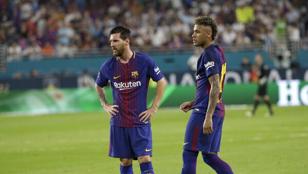 Barcelona's Lionel Messi, left, and Neymar, right, stand on the field during a break in the action during the first half of an International Champions Cup soccer match against Real Madrid, Saturday, July 29, 2017, in Miami Gardens, Fla. - Sputnik International