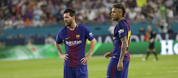 Barcelona's Lionel Messi, left, and Neymar, right, stand on the field during a break in the action during the first half of an International Champions Cup soccer match against Real Madrid, Saturday, July 29, 2017, in Miami Gardens, Fla. - Sputnik International