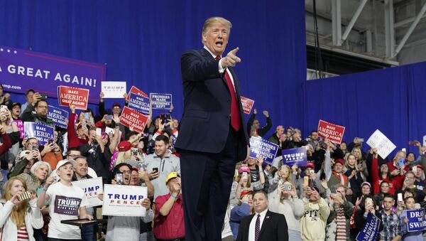 U.S. President Donald Trump points at supporters after speaking in support of Republican congressional candidate Rick Sacconne during a Make America Great Again rally in Moon Township, Pennsylvania, U.S., March 10, 2018 - Sputnik International