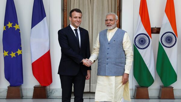 French President Emmanuel Macron shakes hands with India's Prime Minister Narendra Modi during a photo opportunity ahead of their meeting at Hyderabad House in New Delhi, India, March 10, 2018 - Sputnik International