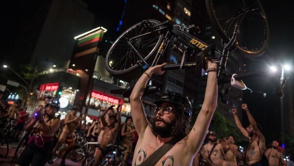 Naked cyclists demonstrate along Paulista Avenue in Sao Paulo, Brazil, to demand better condition of the city roads and to raise awareness on the safety of cyclists and reducing oil dependence, as part of the World Naked Bike Ride (WNBR) international movement, on March 10, 2018 - Sputnik International