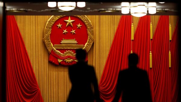 Delegates arrive to the third plenary session of the National People's Congress (NPC) at the Great Hall of the People to take a part in a vote on a constitutional amendment lifting presidential term limits, in Beijing, China March 11, 2018 - Sputnik International
