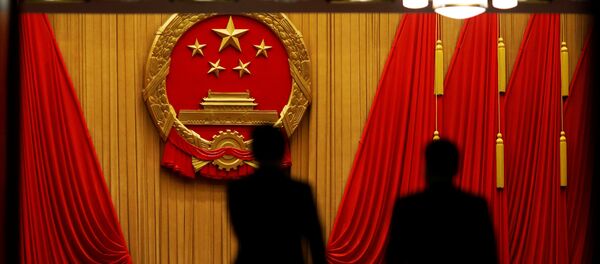 Delegates arrive to the third plenary session of the National People's Congress (NPC) at the Great Hall of the People to take a part in a vote on a constitutional amendment lifting presidential term limits, in Beijing, China March 11, 2018 - Sputnik International