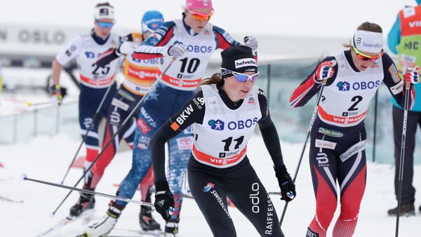 FIS Cross Country World Cup - Women's 30 km Mass Start - Holmenkollen, Norway - March 11, 2018. Nathalie von Siebenthal of Switzerland and Ingvild Flugstad Oestberg of Norway compete - Sputnik International
