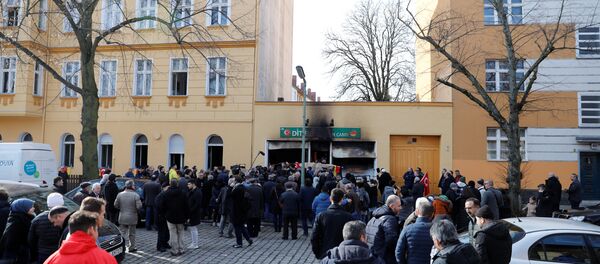 People outside a mosque after it was destroyed by a fire in Berlin, Germany, March 11, 2018 - Sputnik International