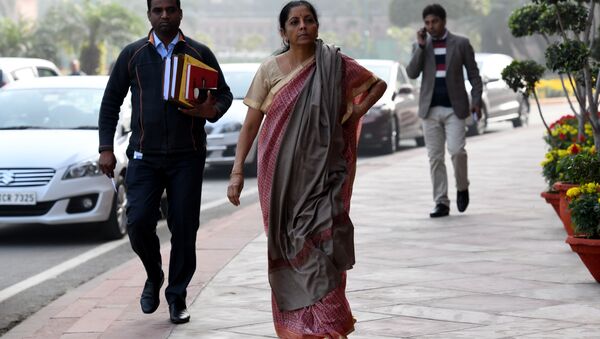 Indian defence minister Nirmala Sitharaman (C) walks after arriving for the winter session of Parliament in New Delhi on December 15, 2017 - Sputnik International