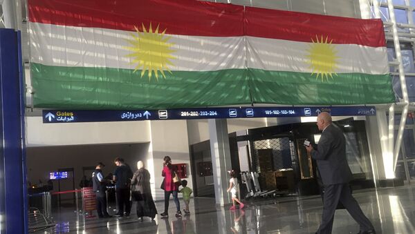 FILE - In this Sept. 27, 2017 file photo, a Kurdish flag hangs in the Irbil International Airport, Iraq. Iraqi Prime Minister Haider al-Abadi said Tuesday, March 13, 2018, that he is reopening airports in Iraq's Kurdish region to international flights after federal authority was restored at the hubs - Sputnik International