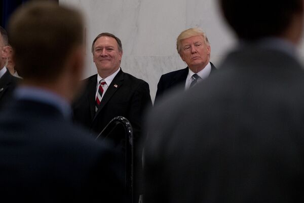 President Donald Trump, accompanied by CIA Director-designate Rep. Michael Pompeo, left, waits to speak at the Central Intelligence Agency in Langley, Va., Saturday, Jan. 21, 2017 - Sputnik International