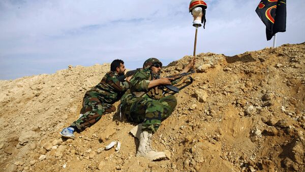 FILE - This Friday, Nov. 22, 2013 file photo, Iraqi and Lebanese Shiite fighters from a group called the Hussein Brigade use a helmet to draw a sniper into view in the town of Hejeira, in the countryside of Damascus, Syria - Sputnik International