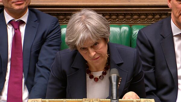 Britain's Prime Minister Theresa May reacts as the leader of the Labour Party Jeremy Corbyn responds to her address to the House of Commons on her government's reaction to the poisoning of former Russian intelligence officer Sergei Skripal and his daughter Yulia in Salisbury, in London, March 14, 2018 - Sputnik International