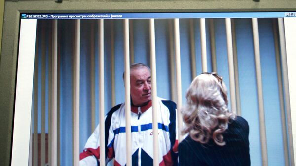 Aug. 9, 2006 file picture Sergei Skripal speaks to his lawyer from behind bars seen on a screen of a monitor outside a courtroom in Moscow - Sputnik International