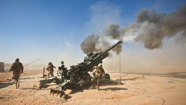 Marines with Charlie Battery, 1st Battalion, 12th Marine Regiment, fire an M982 Excalibur round from an M777 howitzer during a recent fire support mission - Sputnik International