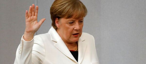 German Chancellor Angela Merkel is sworn-in by Parliament President Wolfgang Schaeuble (not pictured) during a meeting of Germany's lower house of parliament Bundestag in Berlin, Germany, March 14, 2018 German Chancellor Angela Merkel is sworn-in by Parliament President Wolfgang Schaeuble (not pictured) during a meeting of Germany's lower house of parliament Bundestag in Berlin, Germany, March 14, 2018 - Sputnik International