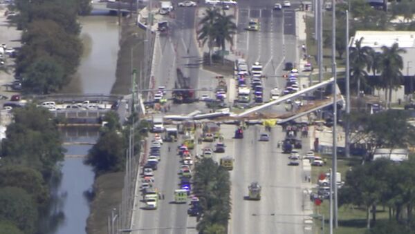 In this frame from video, emergency personnel work at the scene of a collapsed bridge in the Miami area, Thursday, March 15, 2018. - Sputnik International
