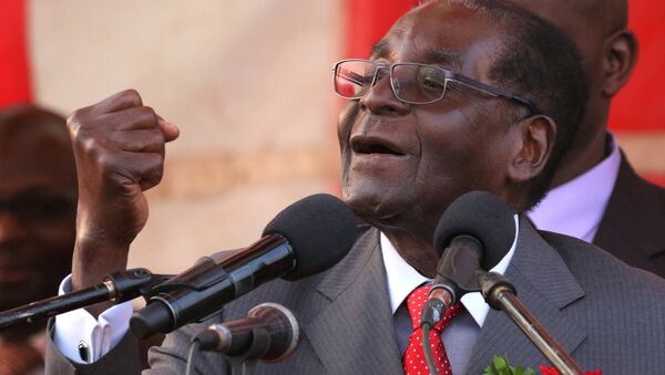 President of Zimbawe Robert Mugabe gestures as he addresses supporters of his ruling ZANU (PF) party (File) - Sputnik International