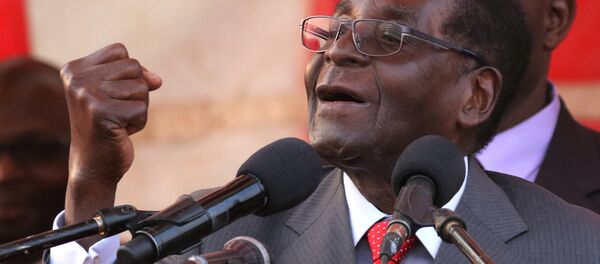 President of Zimbawe Robert Mugabe gestures as he addresses supporters of his ruling ZANU (PF) party (File) President of Zimbawe Robert Mugabe gestures as he addresses supporters of his ruling ZANU (PF) party (File) - Sputnik International