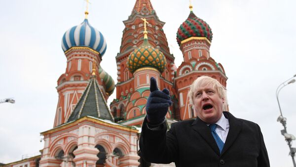 British Foreign Secretary Boris Johnson stands in front of Saint Basil's cathedral in Red square in Moscow on December 22, 2017 after a meeting with his Russian counterpart. - Sputnik International