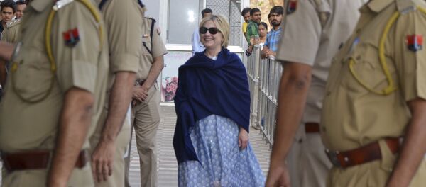 In this Thursday, March 15, 2018 photo, former U.S. Secretary of State Hillary Clinton, center, arrives at the departure terminal of Jodhpur airport in Rajasthan state, India - Sputnik International