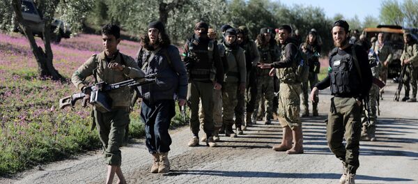 Turkish-backed Free Syrian Army fighters walk together after advancing north of Afrin, Syria March 17, 2018 Turkish-backed Free Syrian Army fighters walk together after advancing north of Afrin, Syria March 17, 2018 - Sputnik International