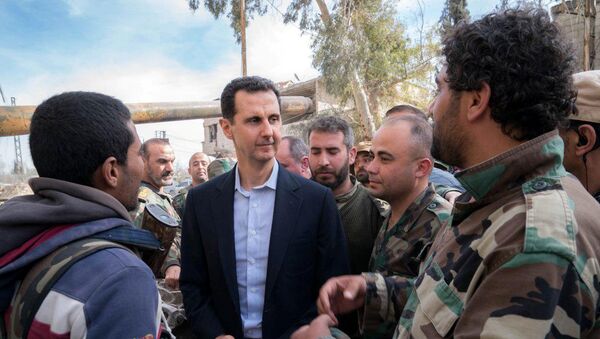Syrian President Bashar al-Assad meets with Syrian army soldiers in eastern Ghouta, Syria, March 18, 2018 - Sputnik International