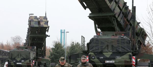 Soldiers of the Air Defence Missile Squadron 2 walk past Patriot missile launchers in the background in Bad Suelze, northern Germany on December 4, 2012 Soldiers of the Air Defence Missile Squadron 2 walk past Patriot missile launchers in the background in Bad Suelze, northern Germany on December 4, 2012 - Sputnik International