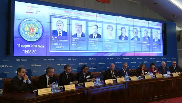Preliminary results of the Russian presidential election shown on a screen at the information center of the Russian Central Election Commission. Fourth right: Ella Pamfilova, chairperson of the Russian Central Election Commission - Sputnik International