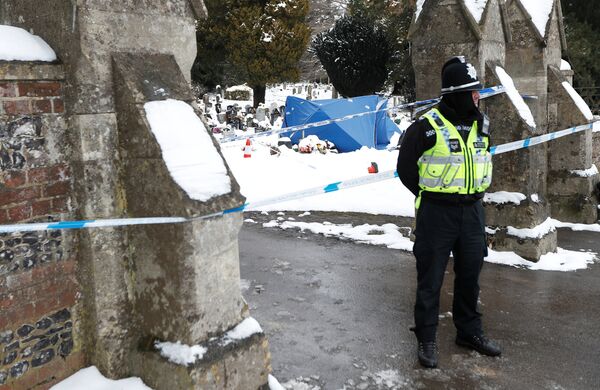 A police officer stands outside the London Road cemetery where the grave of Alexander Skripal; son of former Russian intelligence officer Sergei Skripal; is seen covered with a tent, in Salisbury, Britain A police officer stands outside the London Road cemetery where the grave of Alexander Skripal; son of former Russian intelligence officer Sergei Skripal; is seen covered with a tent, in Salisbury, Britain - Sputnik International