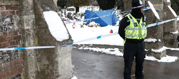 A police officer stands outside the London Road cemetery where the grave of Alexander Skripal; son of former Russian intelligence officer Sergei Skripal; is seen covered with a tent, in Salisbury, Britain A police officer stands outside the London Road cemetery where the grave of Alexander Skripal; son of former Russian intelligence officer Sergei Skripal; is seen covered with a tent, in Salisbury, Britain - Sputnik International