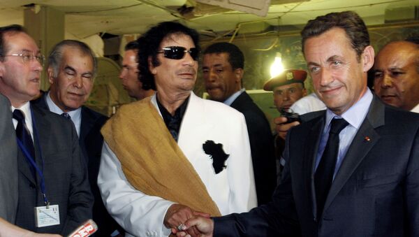 Libya's President Muammar Gaddafi (L) greets his counterpart from France Nicolas Sarkozy at Bab Azizia Palace in Tripoli July 25, 2007, the day after the release of six foreign medics from Libyan jails - Sputnik International