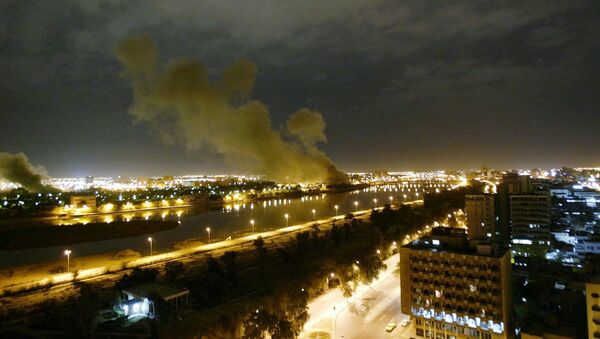 In this March 20, 2003 file photo, smoke rises from the Trade Ministry in Baghdad after it was hit by a missile during US-led forces attacks - Sputnik International