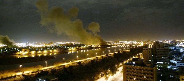 In this March 20, 2003 file photo, smoke rises from the Trade Ministry in Baghdad after it was hit by a missile during US-led forces attacks In this March 20, 2003 file photo, smoke rises from the Trade Ministry in Baghdad after it was hit by a missile during US-led forces attacks - Sputnik International