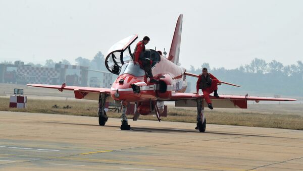(File) Members of the British Royal Air Force (RAF) aerobatic team, the 'Red Arrows' leave the aircraft after performing manoeuvres at the Indian Air Force Academy, Dundigal on the outskirts of Hyderabad on November 17, 2016 - Sputnik International