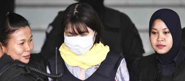 Vietnamese Doan Thi Huong, center, is escorted by police as she leaves a court hearing at the Shah Alam High Court in Shah Alam, Malaysia, Wednesday, March 14, 2018 - Sputnik International