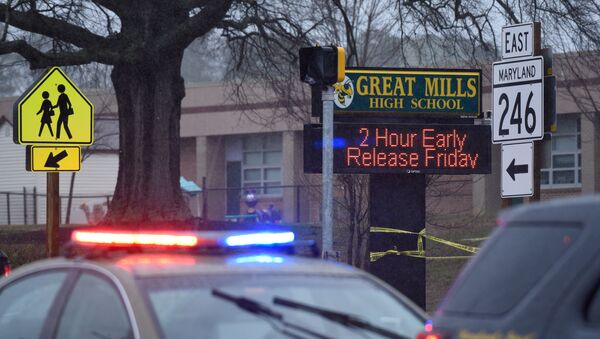 Law enforcement vehicles are seen outside the Great Mills High School following a shooting on Tuesday morning in St. Mary's County, Maryland, U.S., March 20, 2018 - Sputnik International
