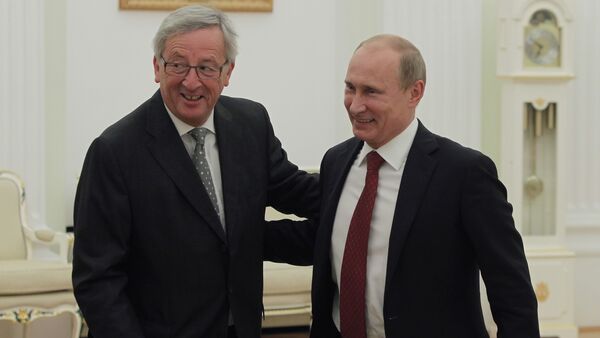 Russian President Vladimir Putin, right, and European Commission President Jean-Claude Juncker. File photo - Sputnik International