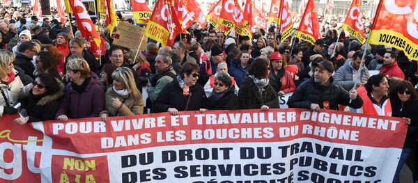 People hold CGT union flags and hold a banner as they take part in a demonstration to protest against French government's string of reforms, on March 22, 2018 in Marseille, southern France - Sputnik International